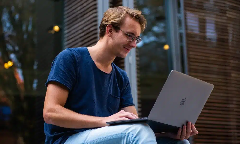 Selective Focus Photo of Man Using Laptop